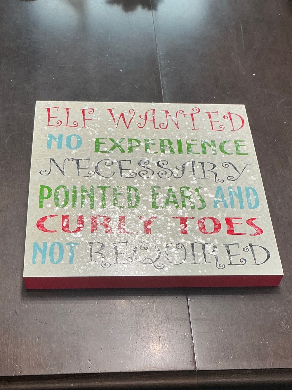 Kirklands Holiday Wall Sign "Elf Wanted" in Red, Green, Blue, Black